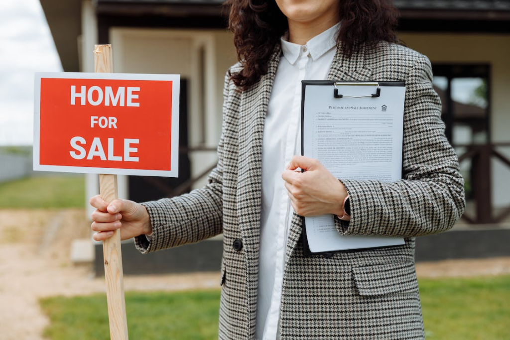 Woman holding a sale sign